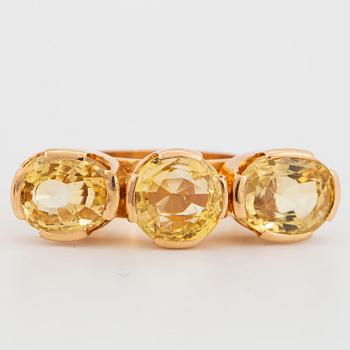 18K gold and yellow sapphire three-stone ring.