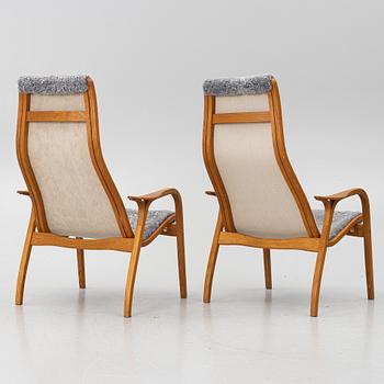 Yngve Ekström, A pair of armchairs, a footstool, “Lamino”, and a side table, Swedese, 2000s.