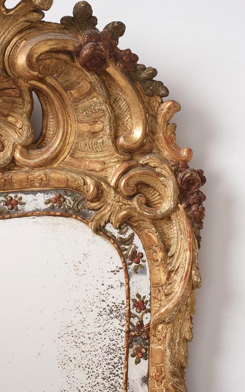 A Swedish giltwood and polychrome-painted Rococo mirror, later part of the 18th century.