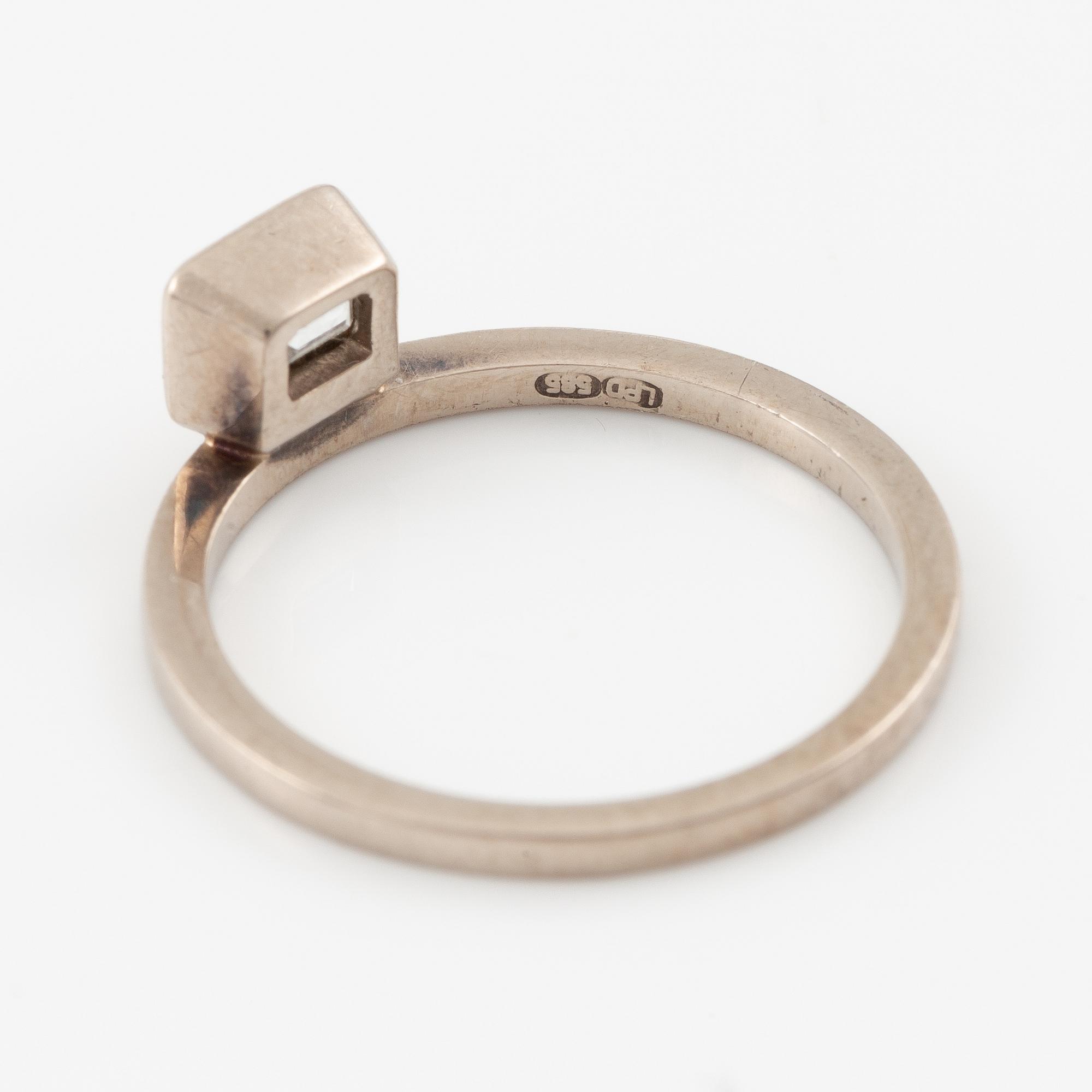 Ring, 14K white gold with emerald-cut diamond.