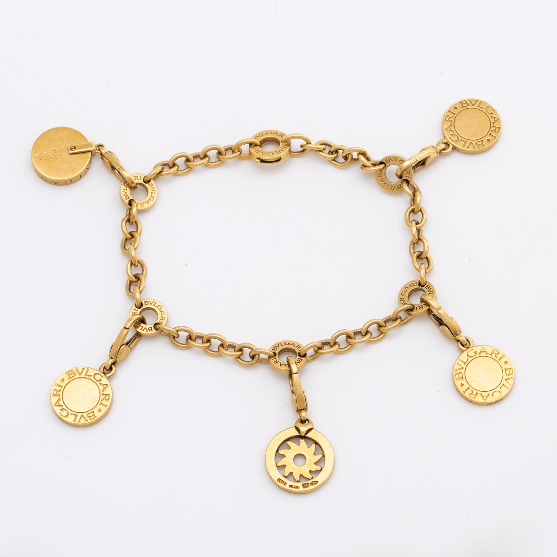 BVLGARI BRACELET w 5 charms (detachable), 18K gold and whitegold, onyx, mother-of-pearl, brilliant-cut diamonds 0,20 ct.