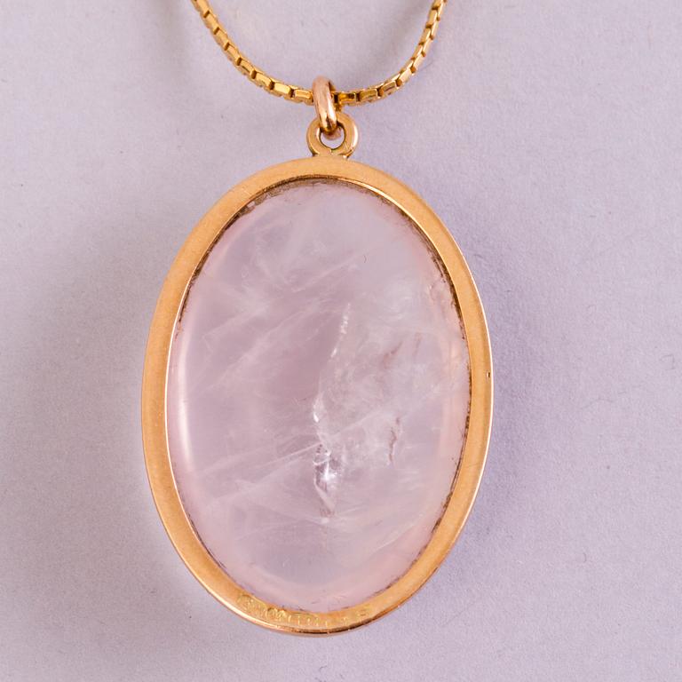 A 1950s three piece jewellery set with 14K gold and rose quartz.