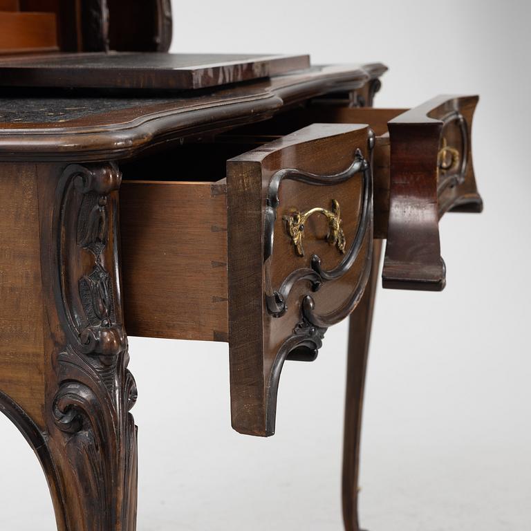 A mahogany veneered desk, mid 20th Century.