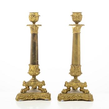 A pair of brass and bronze late Empire candle sticks, mid 20th century.