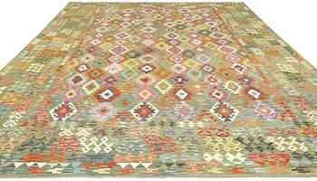 A kilim carpet, c. 504 x 369 cm.