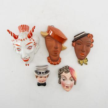Wall masks 5 pcs including Goldscheider mid-20th century porcelain/terracotta.