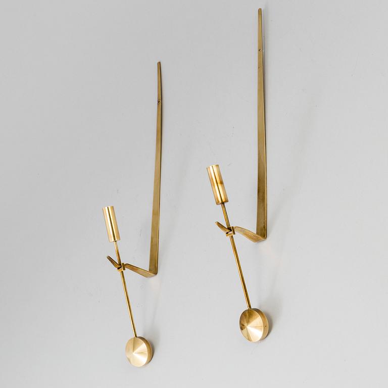 A pair of brass wall candle holders by Pierre Forsell, Skultuna.