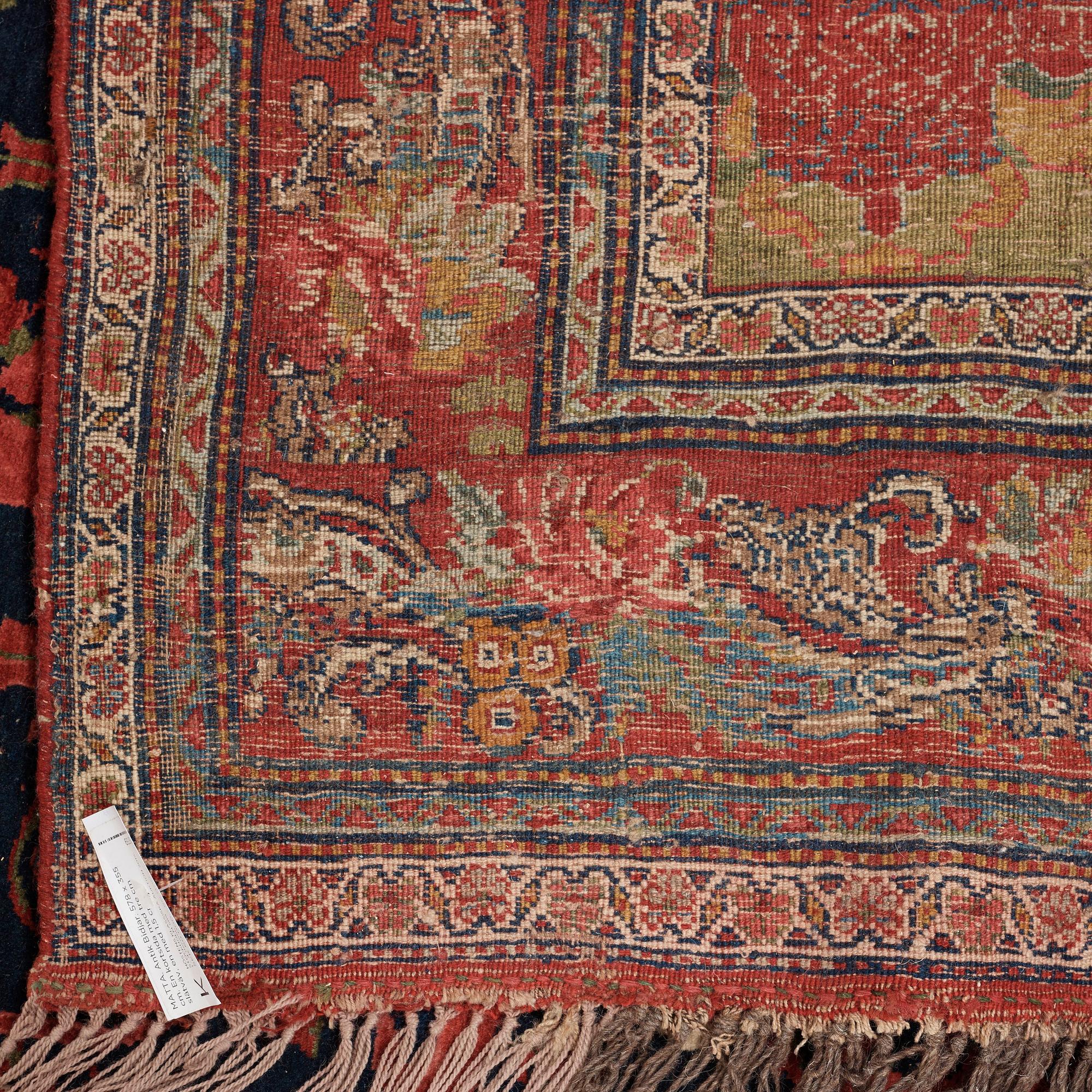 CARPET. Antique Bidjar. 578 x 355 cm, plus one end has 3 cm red flatweave, one has 1,5 cm.
