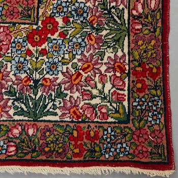 A RUG, a semi-antique Kerman "mille-fleur", ca 198,5 x 136,5 cm.