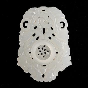 Two carved pendant, white jadeit and green stoen, China, 20th century.