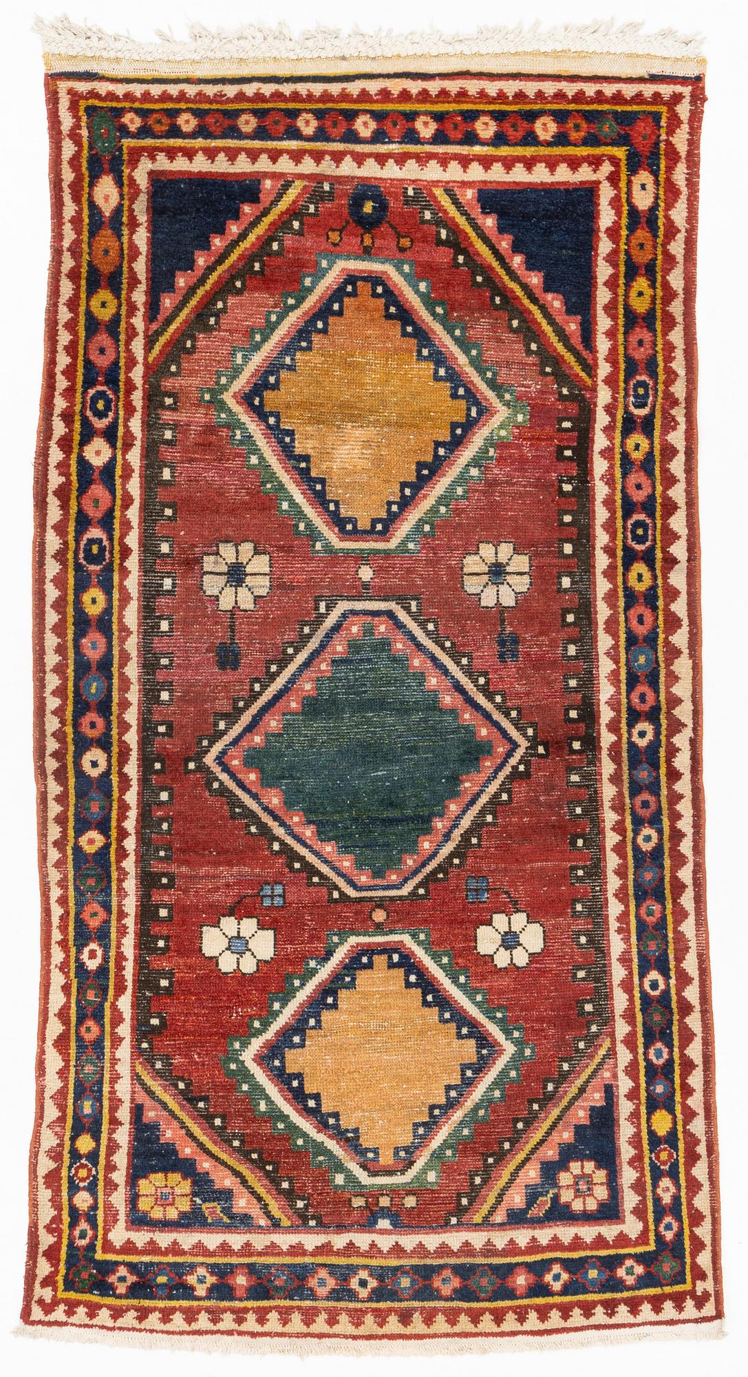 A semi-antique Khersake-Bakthiari carpet, ca 268 x 128-145 cm.