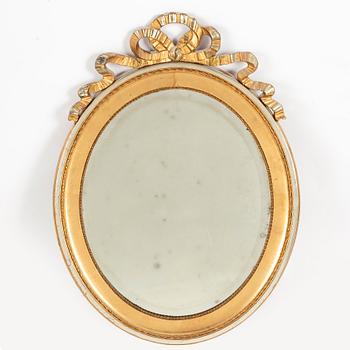 A gustavian style mirror, first half of the 20th century.