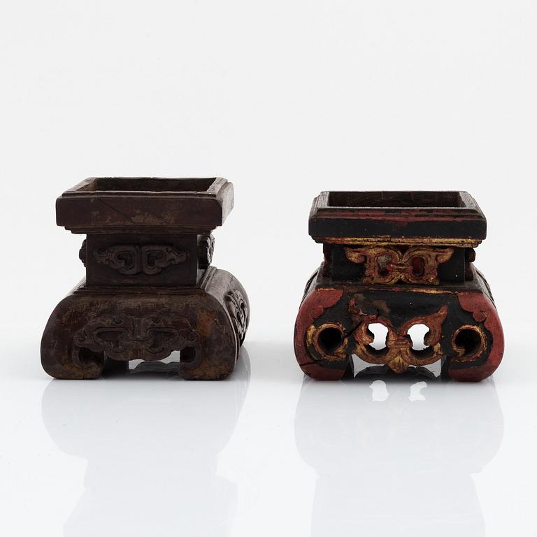 A set of three carved wooden stands, early 20th Century.