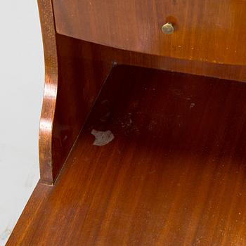 A pair of 20th century bedside tables.