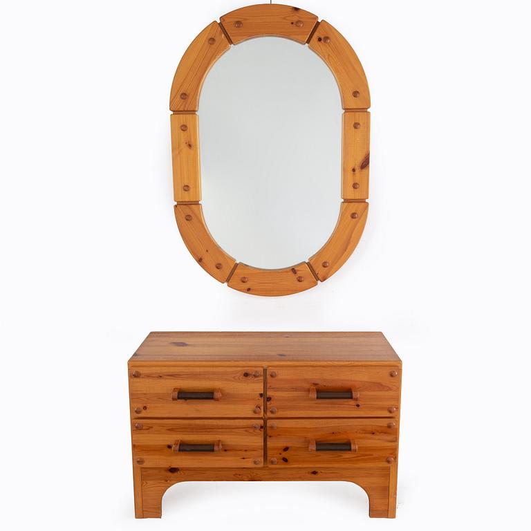 A 1970's set with a pine mirror and chest of drawers.