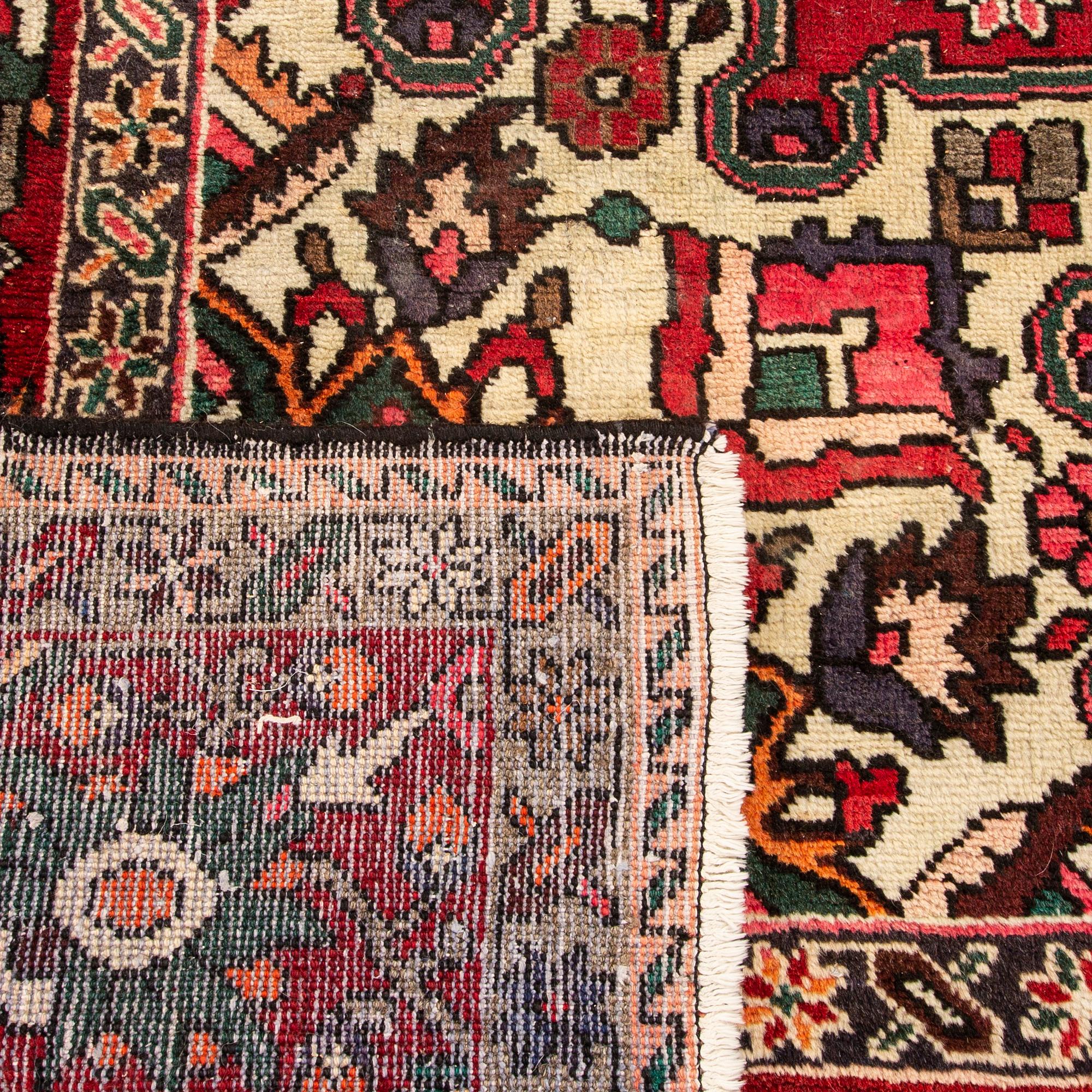 An old bachtiari carpet ca 310x210 cm.