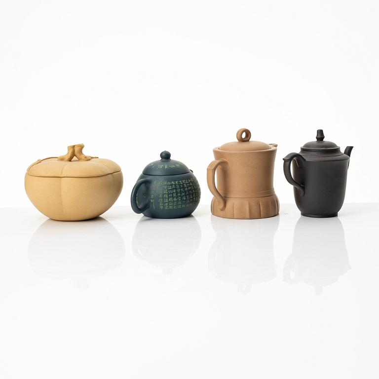 A group of three yixing teapots and a box with cover, China, 1970/80s.