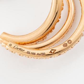 A pair of Cartier earrings in 18K gold set with round brilliant-cut diamonds.