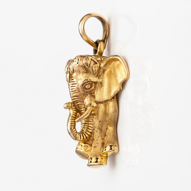 A 14K gold elefant shaped pendant.