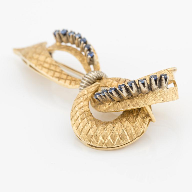 Brooch, 18K gold in the shape of a bow with sapphires, Italy.