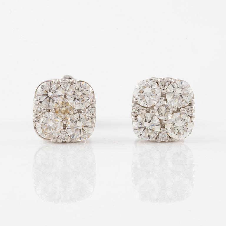 A pair of earrings in 18K white gold set with round brilliant-cut diamonds.