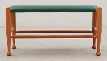 A Josef Frank mahogany and green leather bench, Svenskt Tenn, model 2009.
