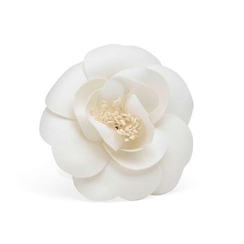 CHANEL, a white brooch.