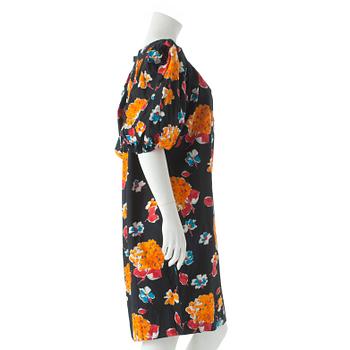 YVES SAINT LAURENT, a black cotton dress with flower motif.