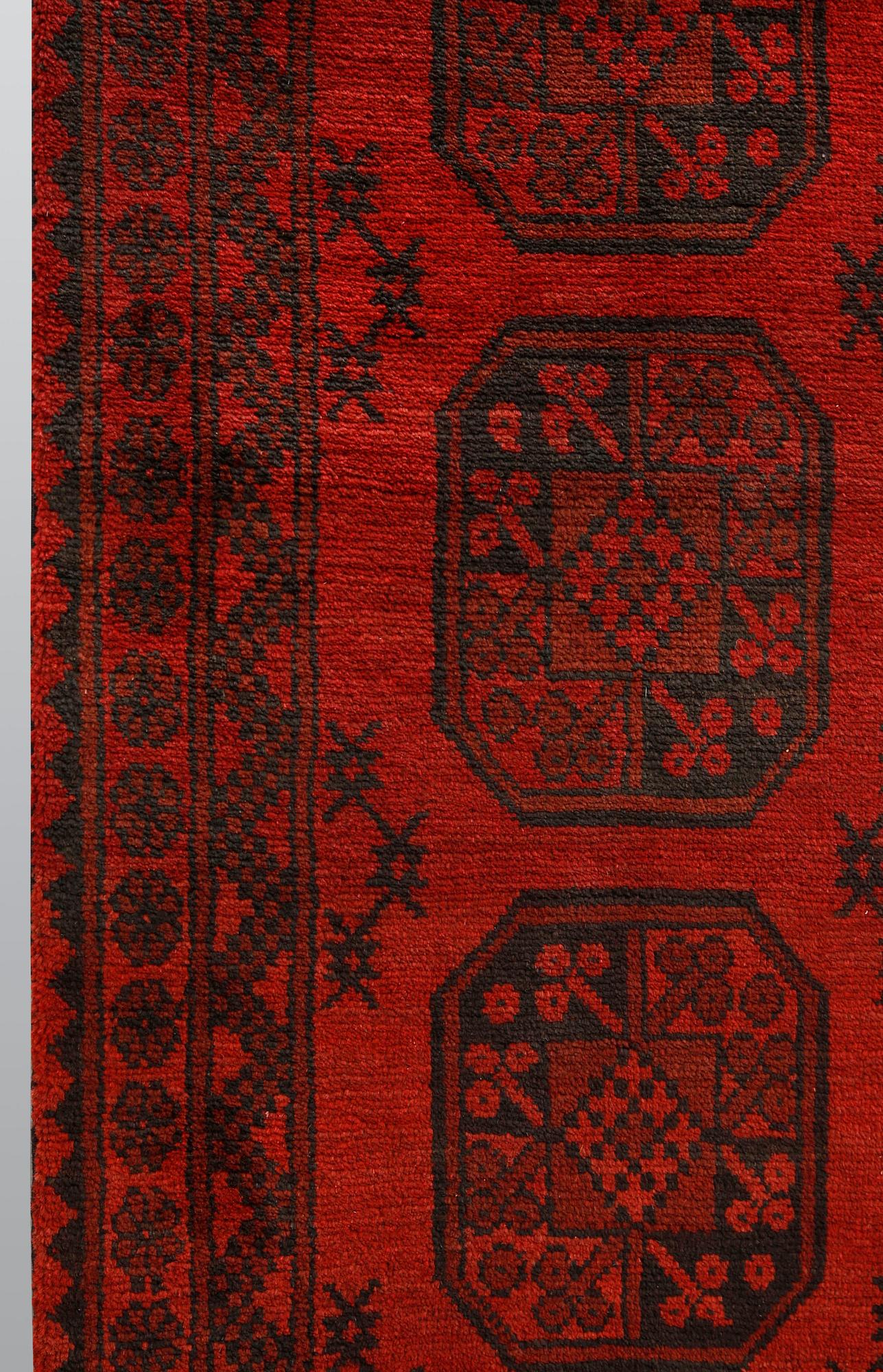AnAfghan runner, ca 575 x 78 cm.