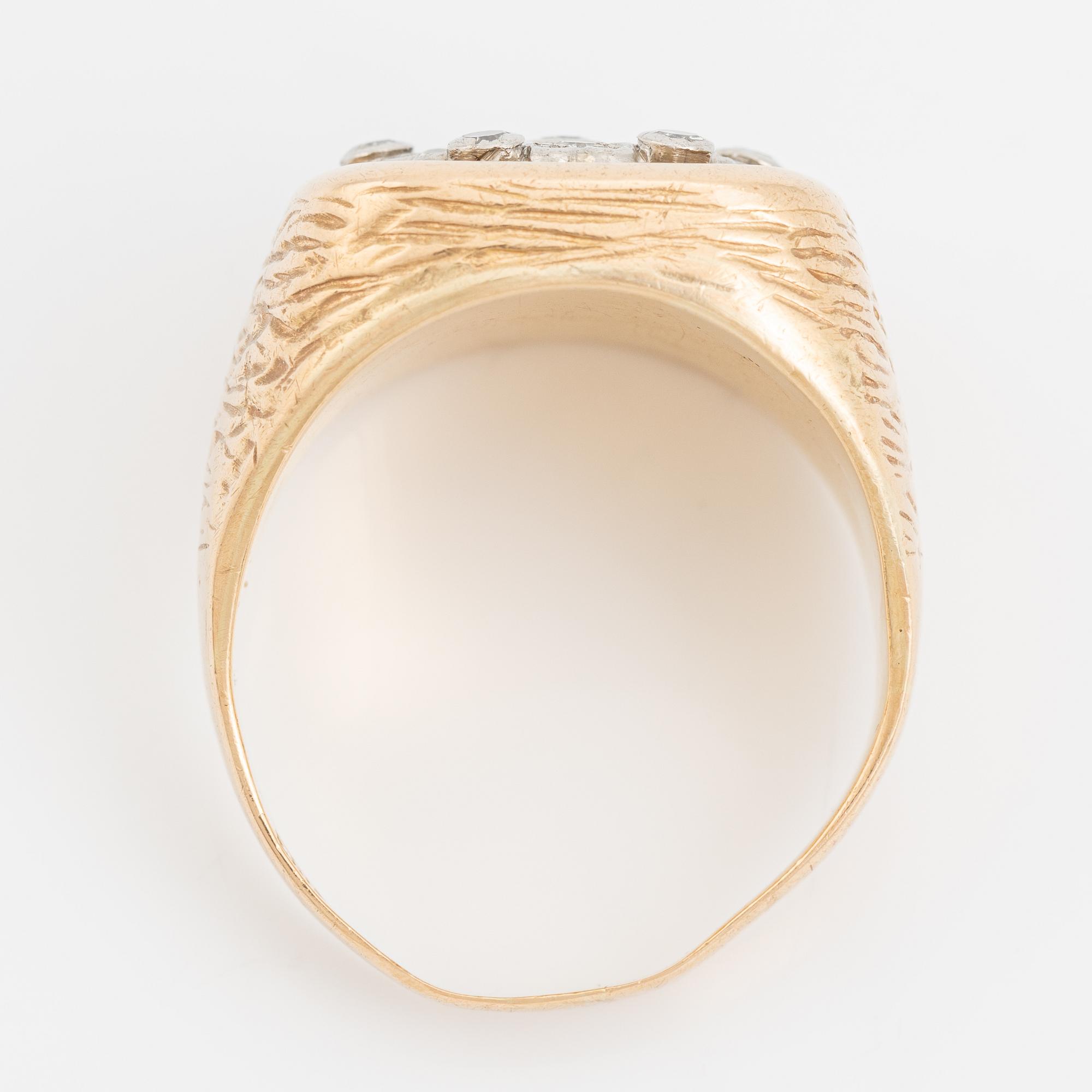 An 18K gold ring set with eight-cut diamonds.