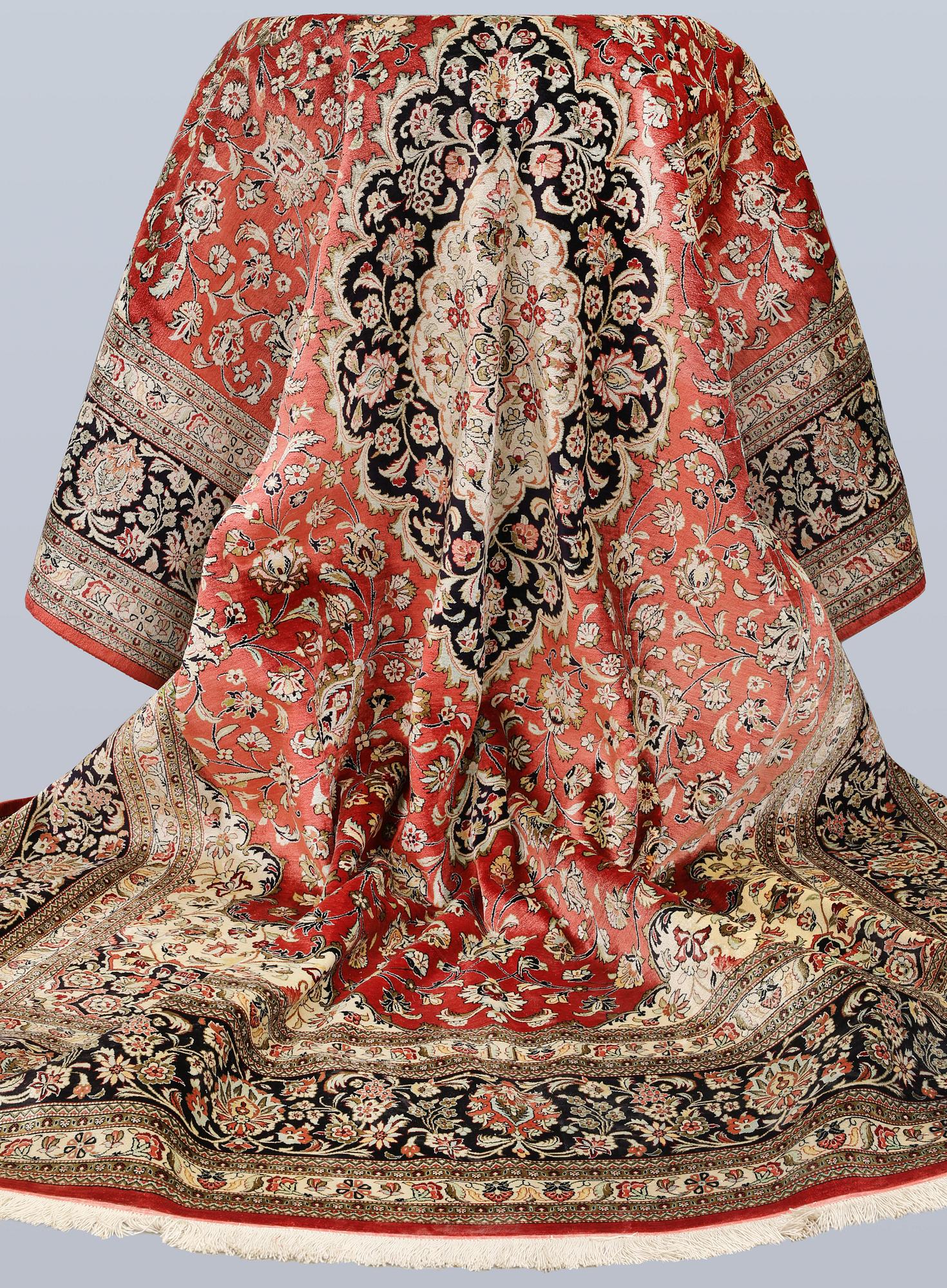 A silk Ghom carpet, c. 346 x 247 cm.