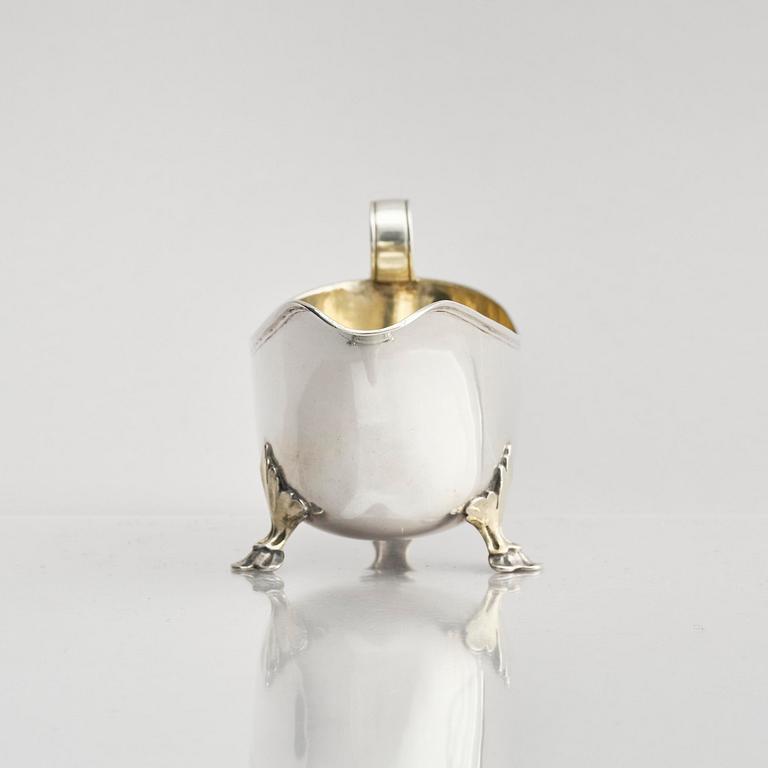 A Swedish early 19th century parcel-gilt cream-jug, mark of Johan Wasserman, Lindesberg, Sweden 1810.