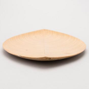 A plywood dish signed TW.