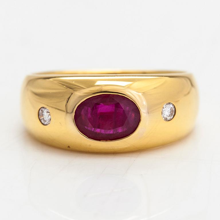 A 14K gold ring, set with an oval-cut ruby and diamonds totaling approx. 0.06 ct. Finland, 1999.