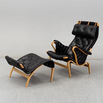 BRUNO MATHSSON, easy chair and foot stool, 'Pernilla', Dux, second half of the 20th century.