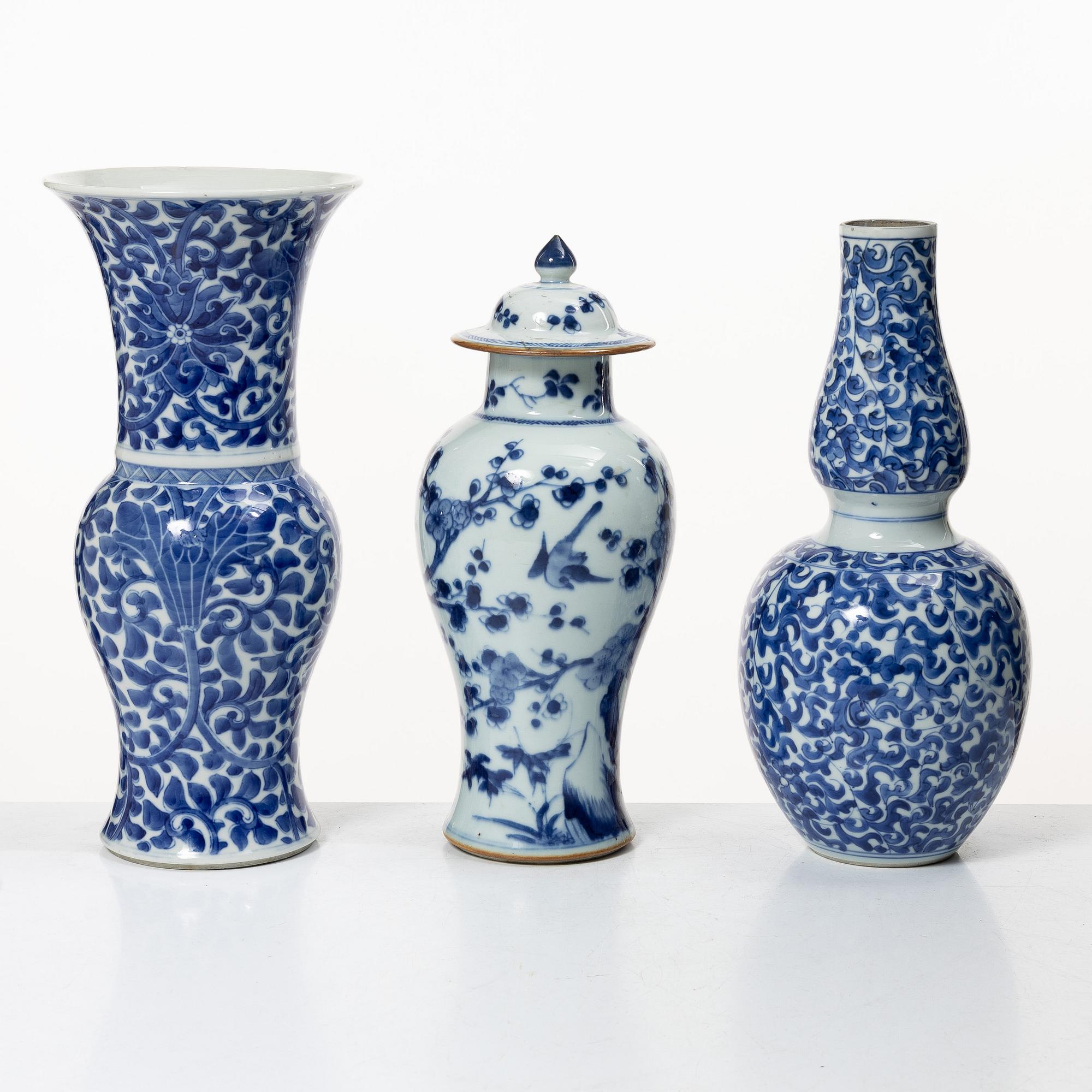 Two blue and white vases, Qing dynasty, 19th century and a blue and white vase with cover, 18th century.
