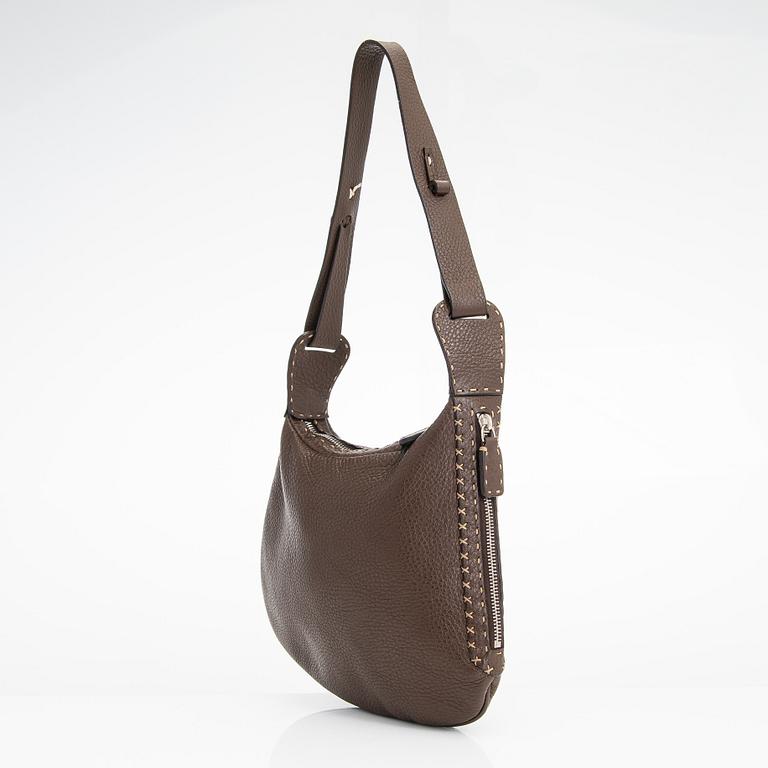 Fendi, a brown leather bag.