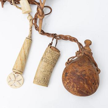 Half-horn knives, cup, bottle, needle case.