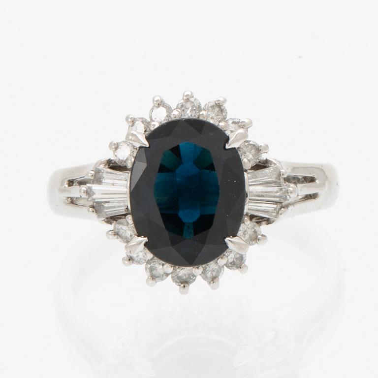 Ring, Platinum 850 with brilliant and tapered baguette cut diamonds and an oval faceted sapphire.