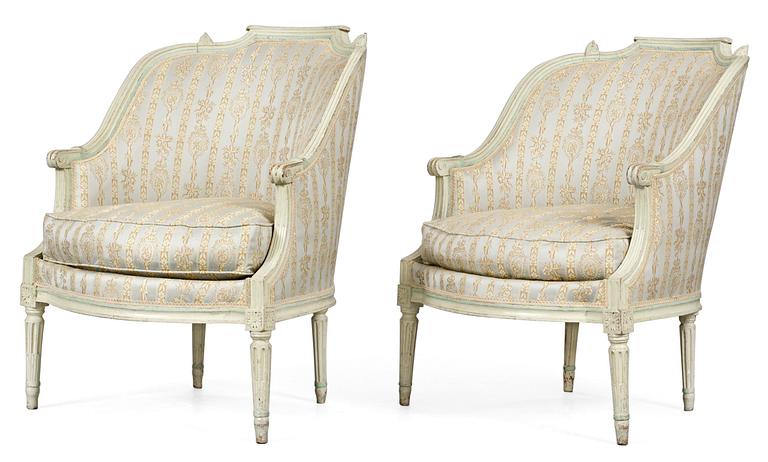 A pair of Louis XVI bergeres.