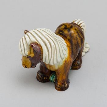 GUNNAR NYLUND, a chamotte stoneware figurine of a horse, from Rörstrand.