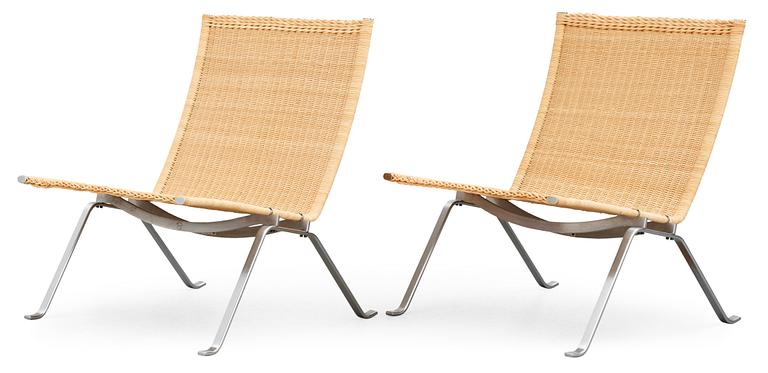 A pair of Poul Kjaerholm 'PK-22' steel and ratten easy chairs, Fritz Hansen, Denmark 1989.
