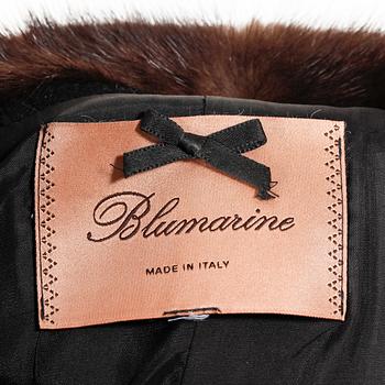 BLUMARINE, a black wool jacket with mink fur.