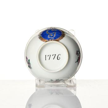 A famille rose armorial cup and stand with the monogram of the Swedish King Gustavus III, Qing dynasty, 18th century.