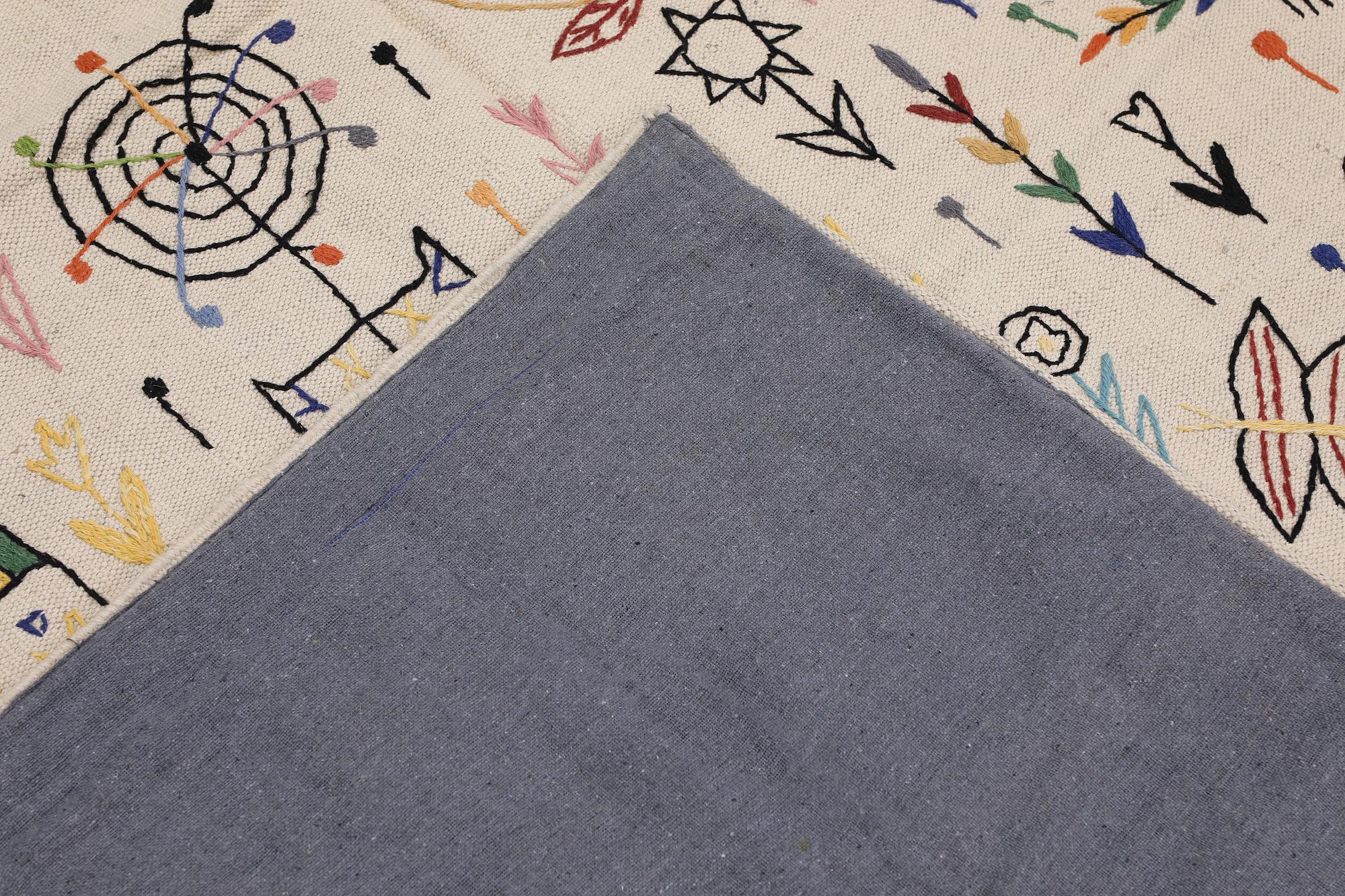 A Kilim carpet with hand-embroidered decoration, 239 x 182 cm.