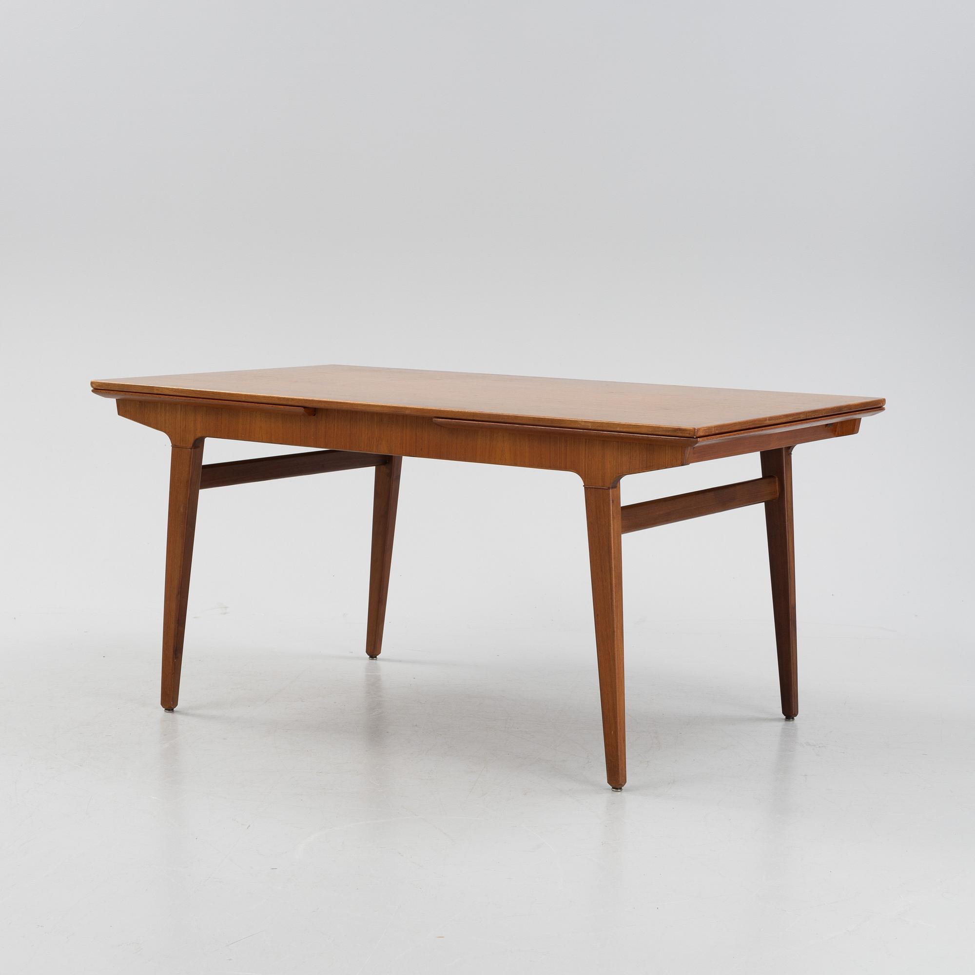 A 1960s teak veneer dining table.
