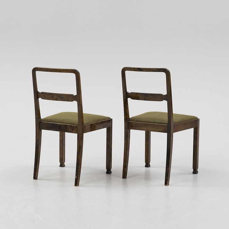 A Swedish Grace birch dining table and four chairs, 1920's/1930's.