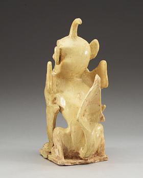 A yellow glazed pottery guardian, Tang dynasty (618-907).