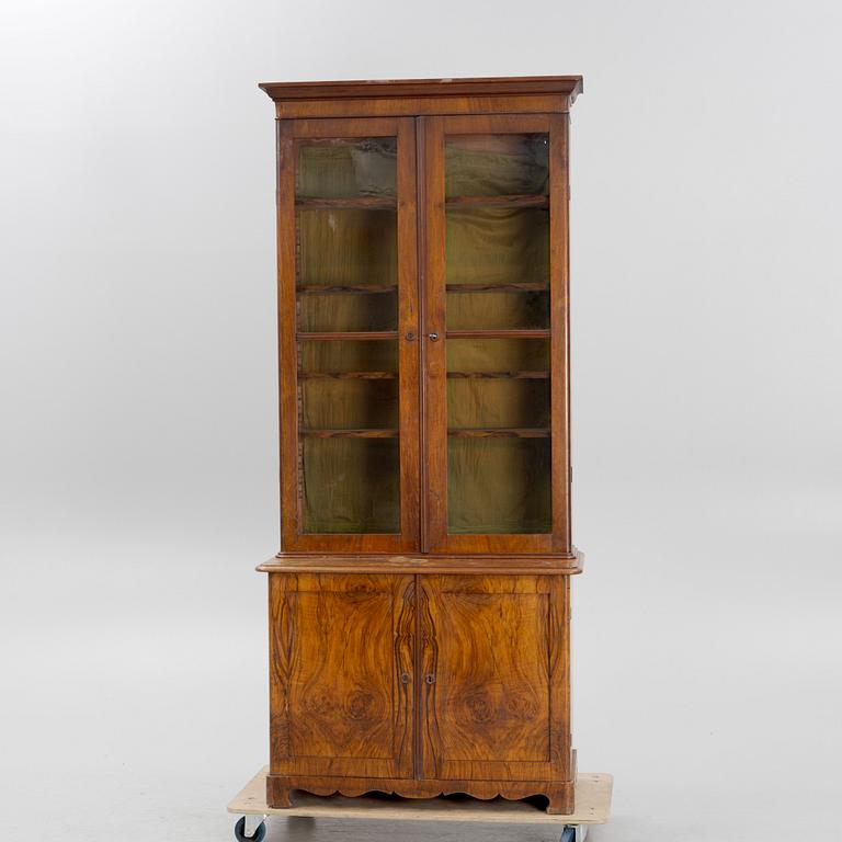 A 19th century walnut veneered  book cabinet.