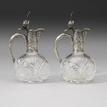 A pair of Russian 20th century parcel-gilt and glass flcongs, possibly of Ivan Katorsky, St. Petersburg 1899-1908.